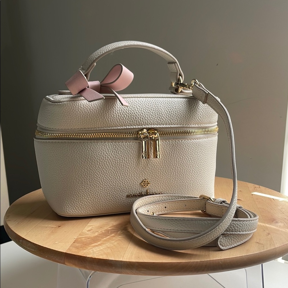 Nanette Lepore Cream and Pink Cosmetic Bags with Contemporary Design